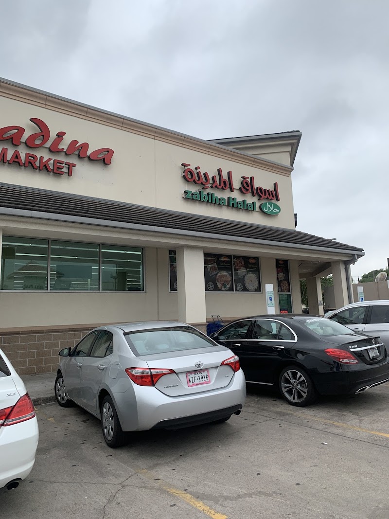 Almadina International Supermarket logo