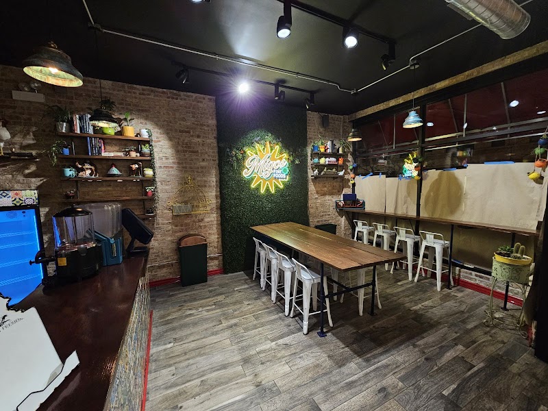 Migos Fine Foods logo